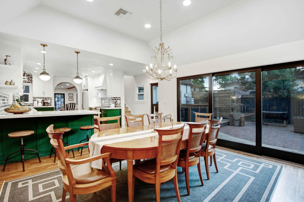 Open-concept kitchen remodel with green island in San Dimas by Dollhouse Construction
